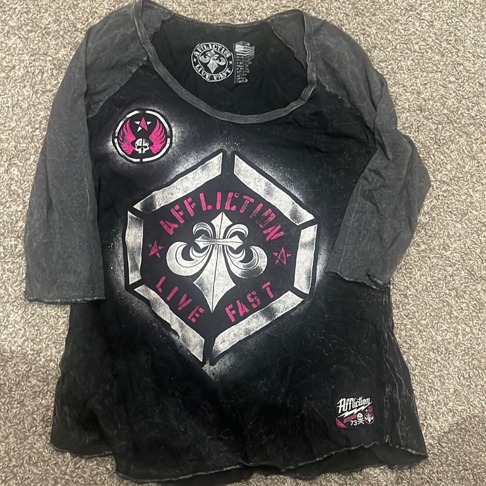 Charcoal quarter sleeve shirt.
